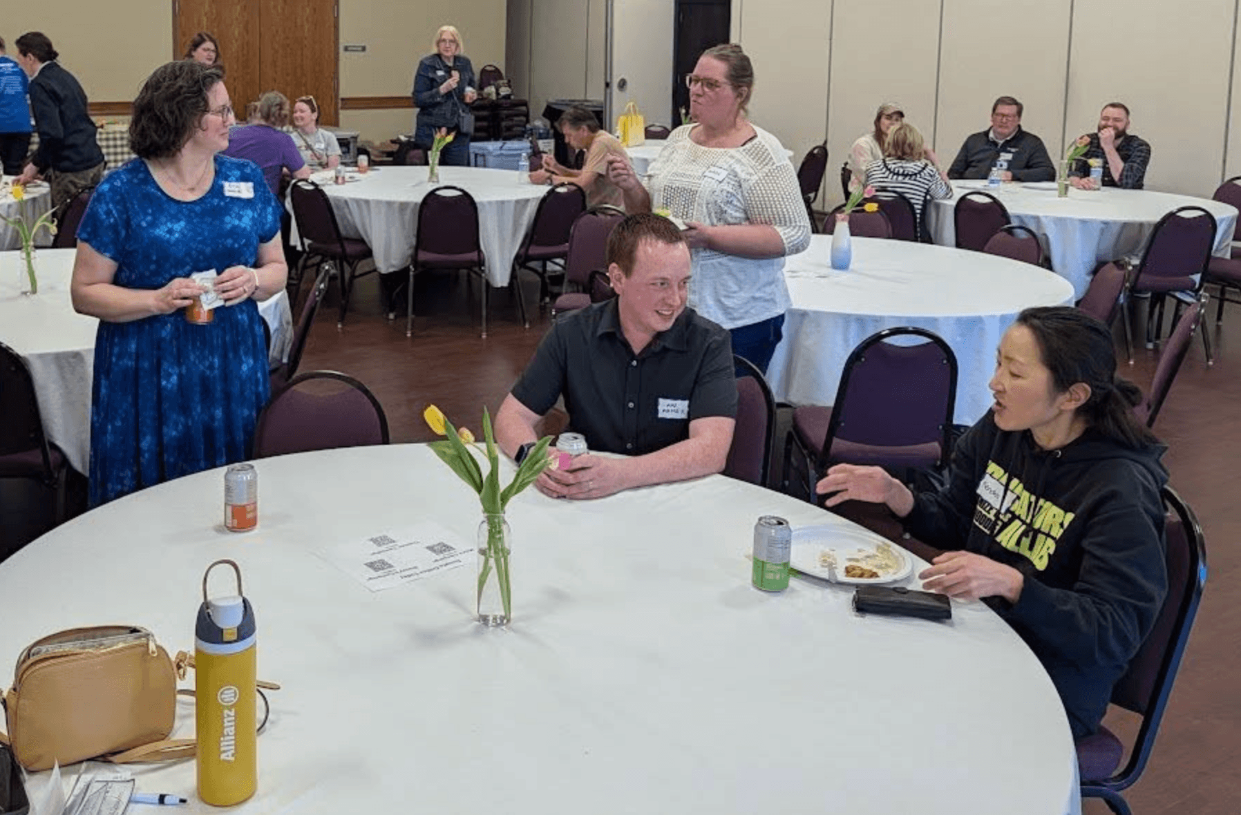 Max Maher speaking with community members at a campaign event